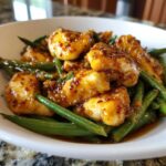 Close-up of glazed chicken pieces mixed with vibrant green beans, a perfect 30 minute chicken and green beans dish.