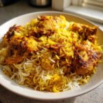 A close-up of flavorful Instant Pot Chicken Shawarma Rice with golden chicken pieces and saffron-colored rice.