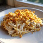 A serving of creamy Chicken Spaghetti featuring shredded chicken and a golden, crunchy breadcrumb topping.