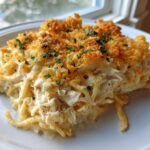 A generous serving of creamy Chicken Spaghetti topped with golden, crunchy breadcrumbs and fresh parsley.