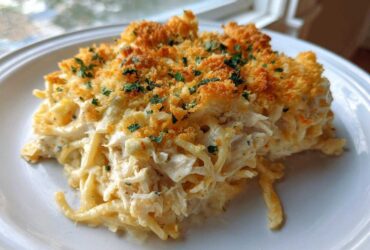 A generous serving of creamy Chicken Spaghetti topped with golden, crunchy breadcrumbs and fresh parsley.